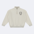 An off-white quarter-zip sweatshirt with a black and white life preserver graphic and the text 'SALTY SHORE' printed on the left chest, displayed on a clean white background.